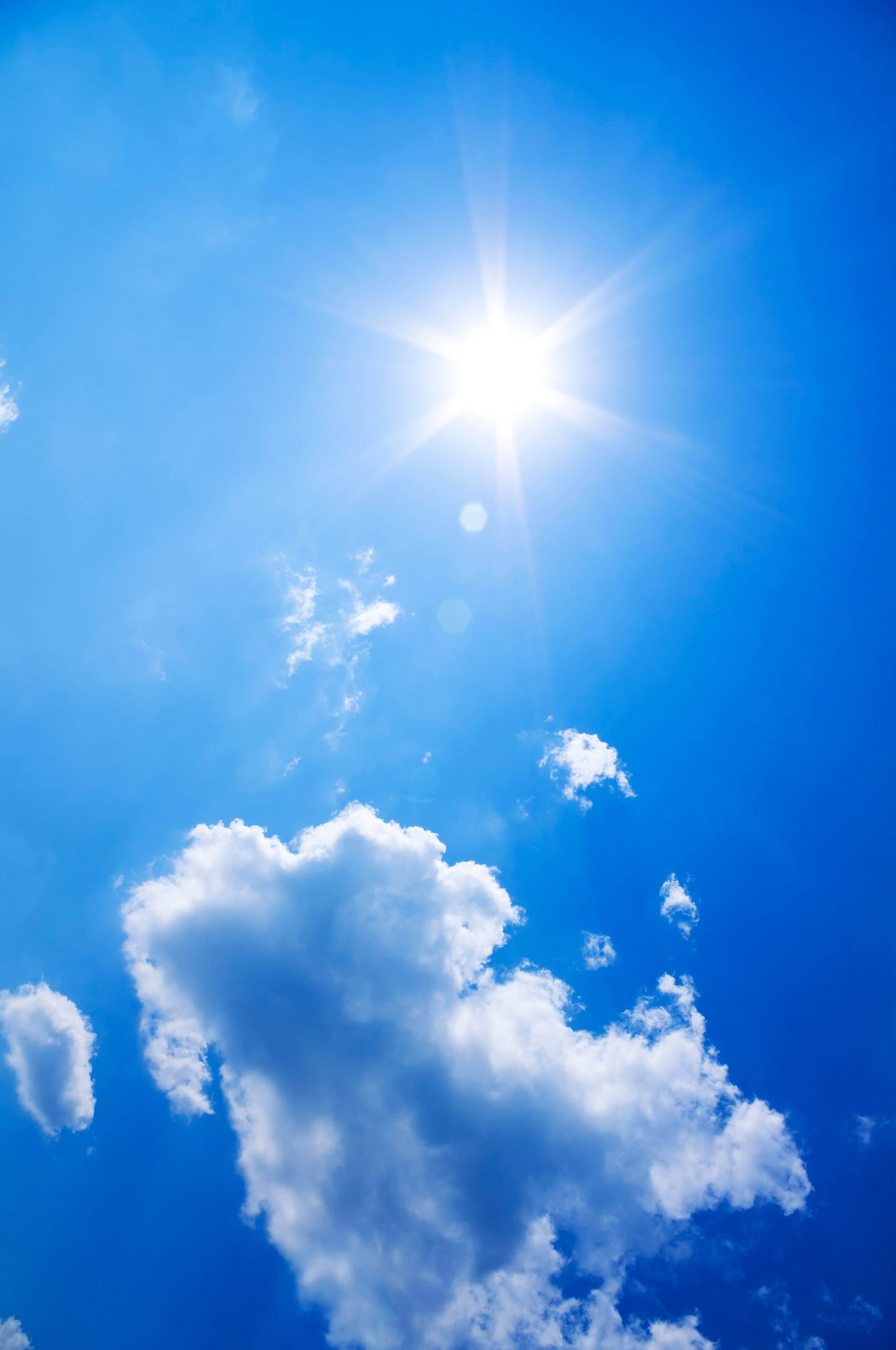 The sun shining in a blue sky