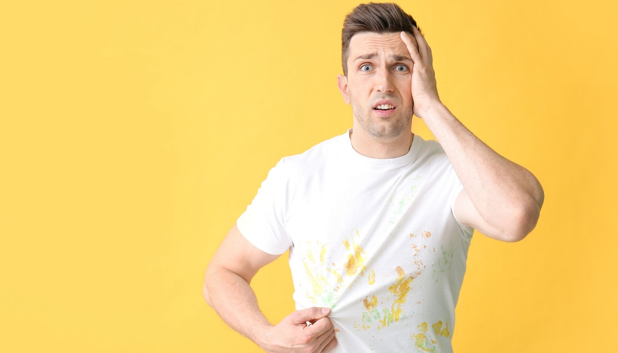 Confused white male with food stains on his shirt