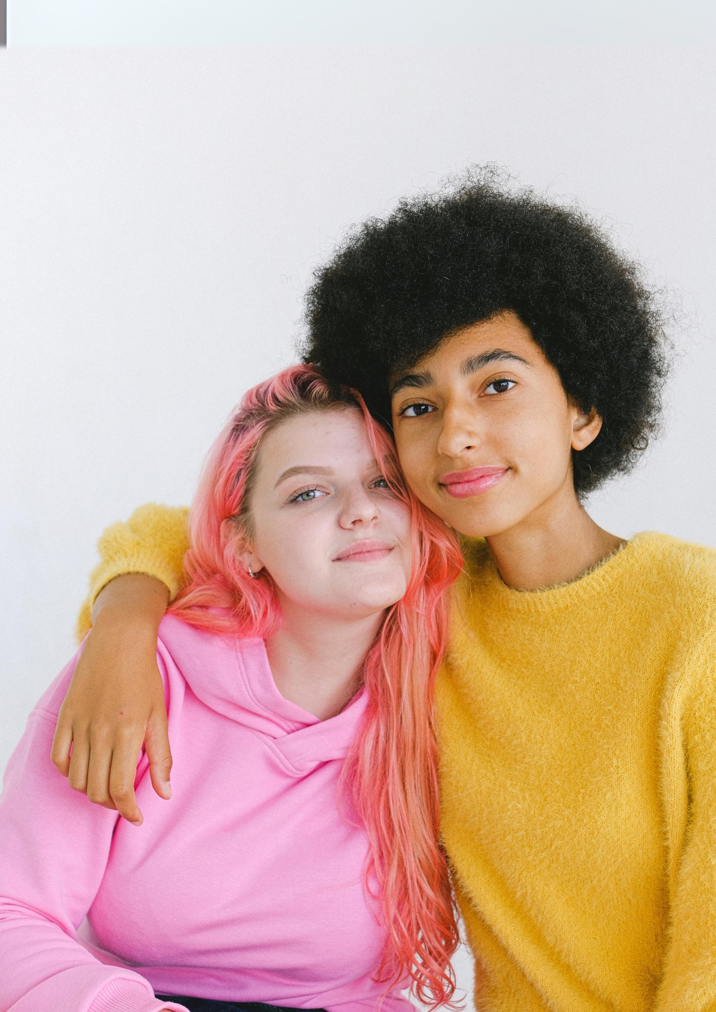 A boy and girl hug
