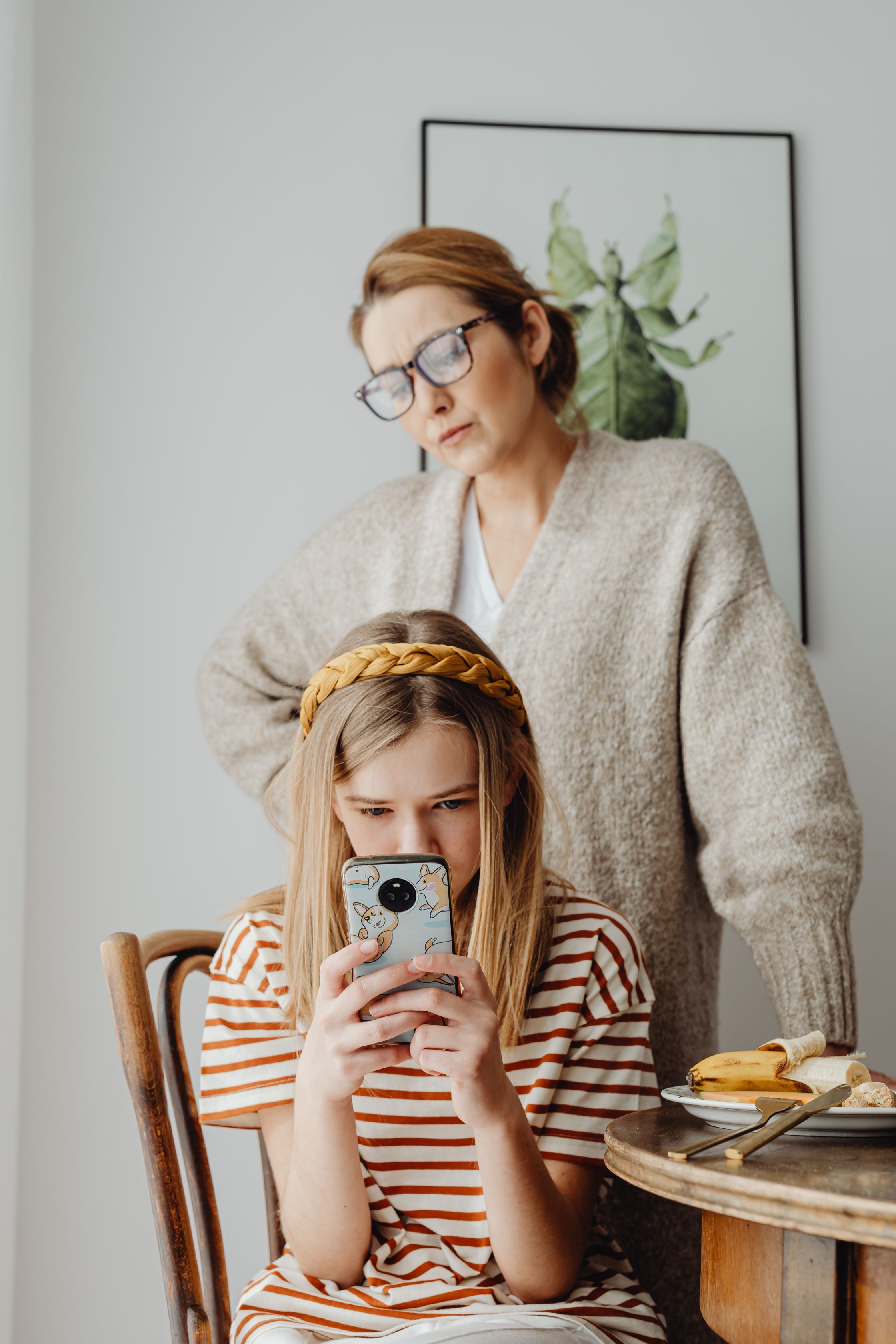 A child looks at her phone