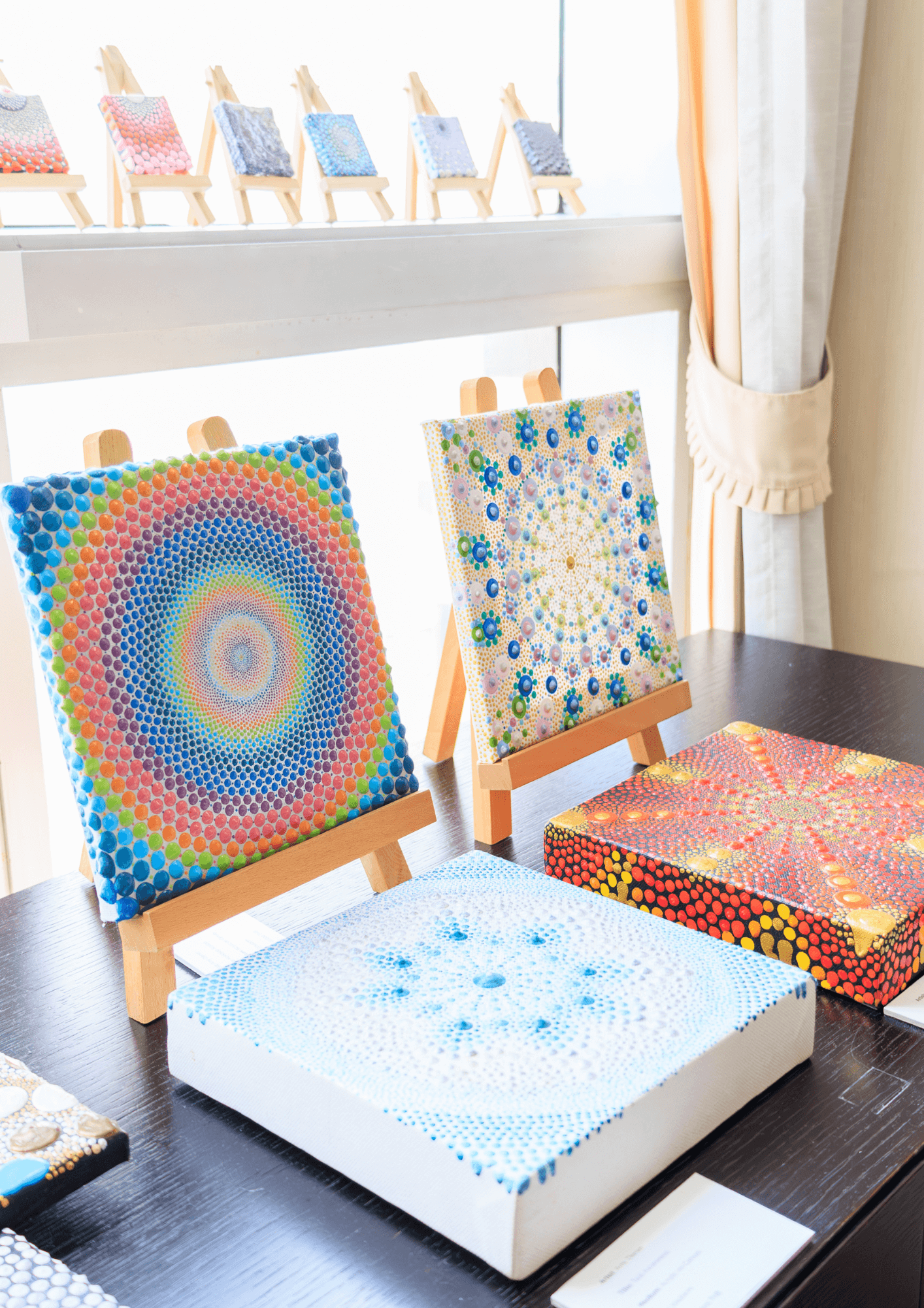 Small dot paintings done on canvas