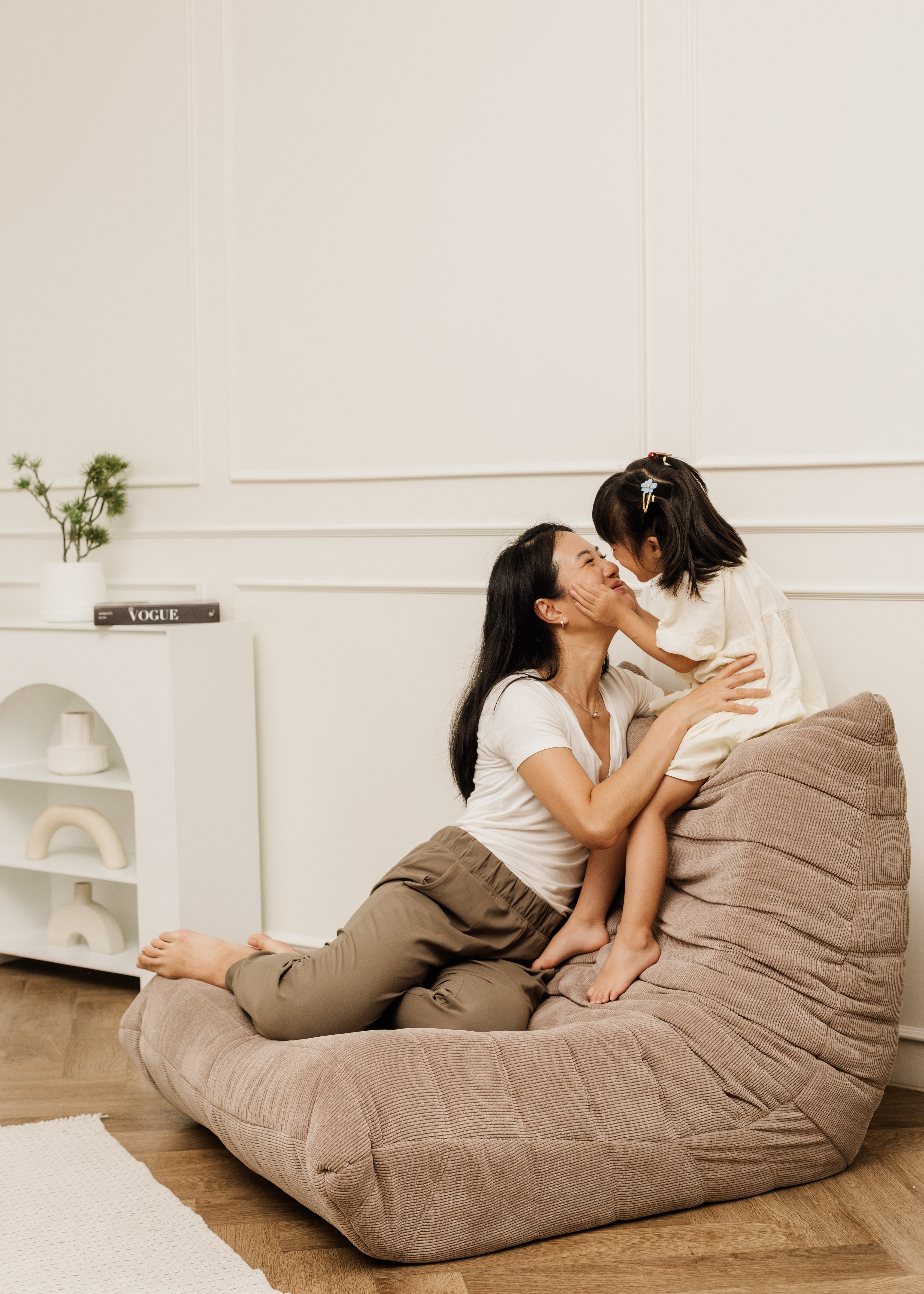A mother and daughter kiss