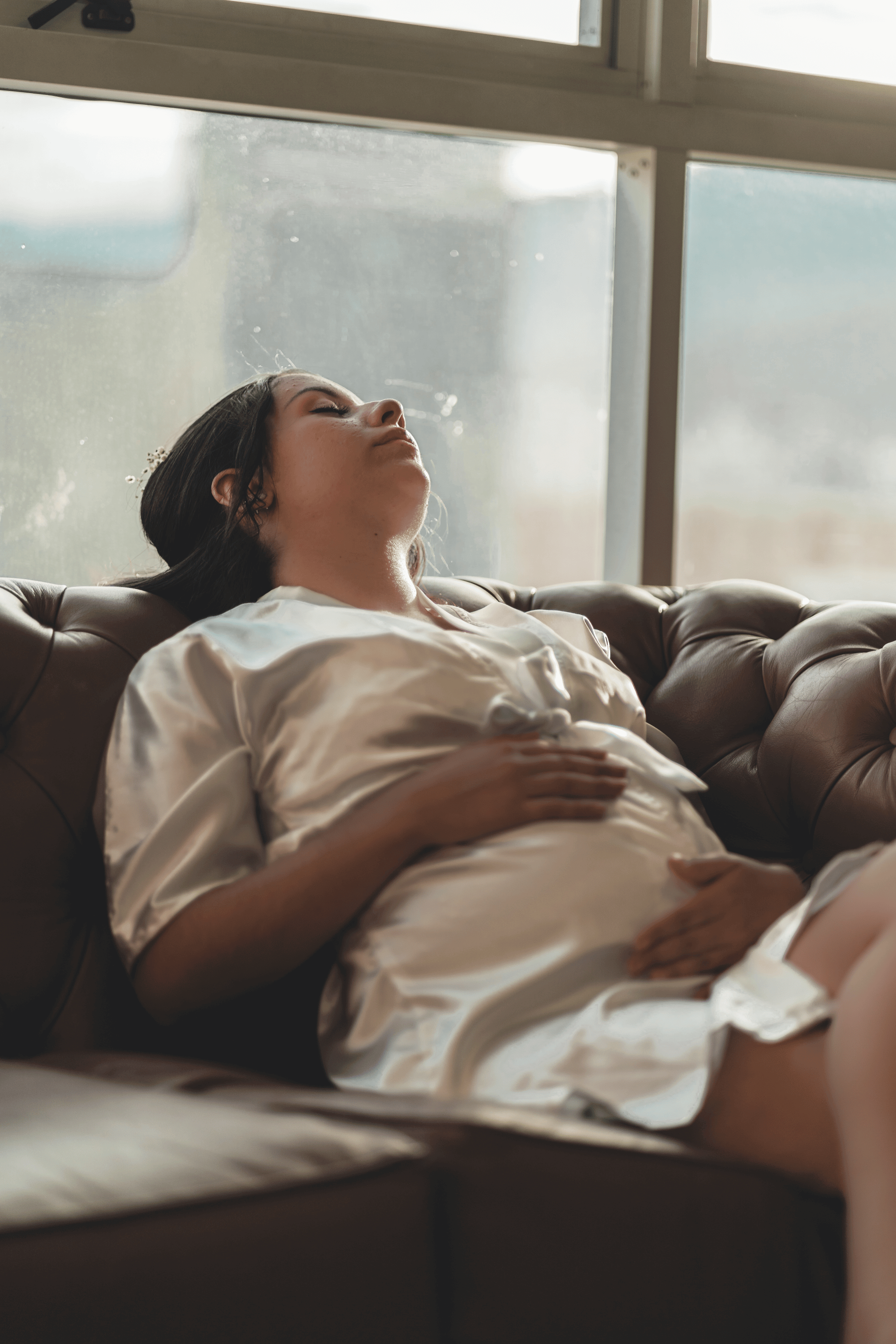 A lady sleeps on a couch