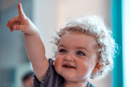 A toddler points