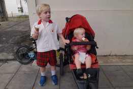 Two children eat ice creams