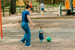A family play in the playground