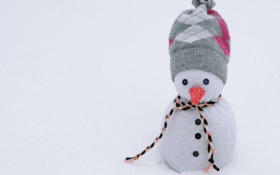 A cute handcrafted snowman made from a sock.