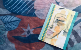 A hand-bound book with a watercolor cover