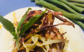 A dish of air-fried chicken with mashed potato and green beans