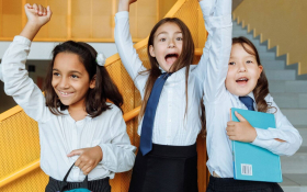 A group of school children smiling