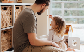 A dad plays with his child