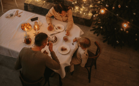 A family eats Christmas dinner