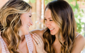 Two women talk together