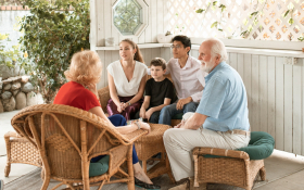 A family sit around a table