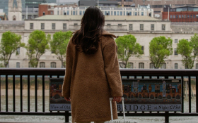 A woman leaves a train station