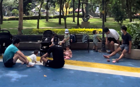 Parents sit with their kids